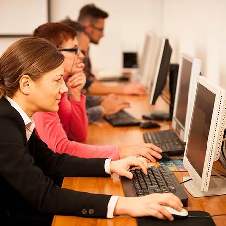 group of students taking a test on computers