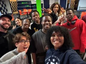 Group of student smiling for a selfie.