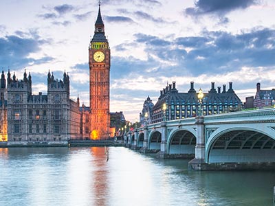 A serene view of Big Ben and Westminster Bridge in London at dusk