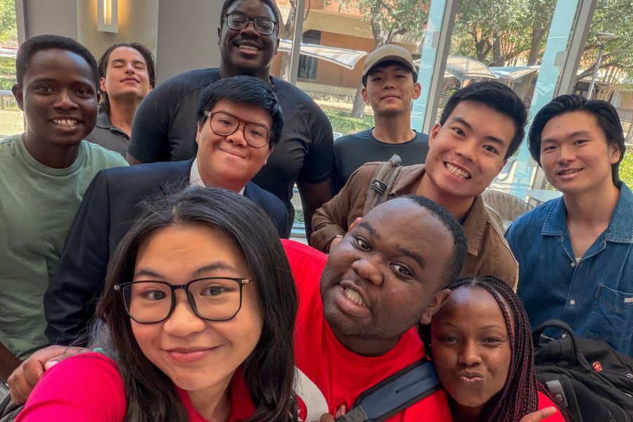 A group of students take a selfie on campus